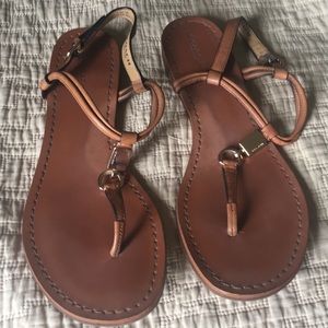 Brown Coach strap sandals.